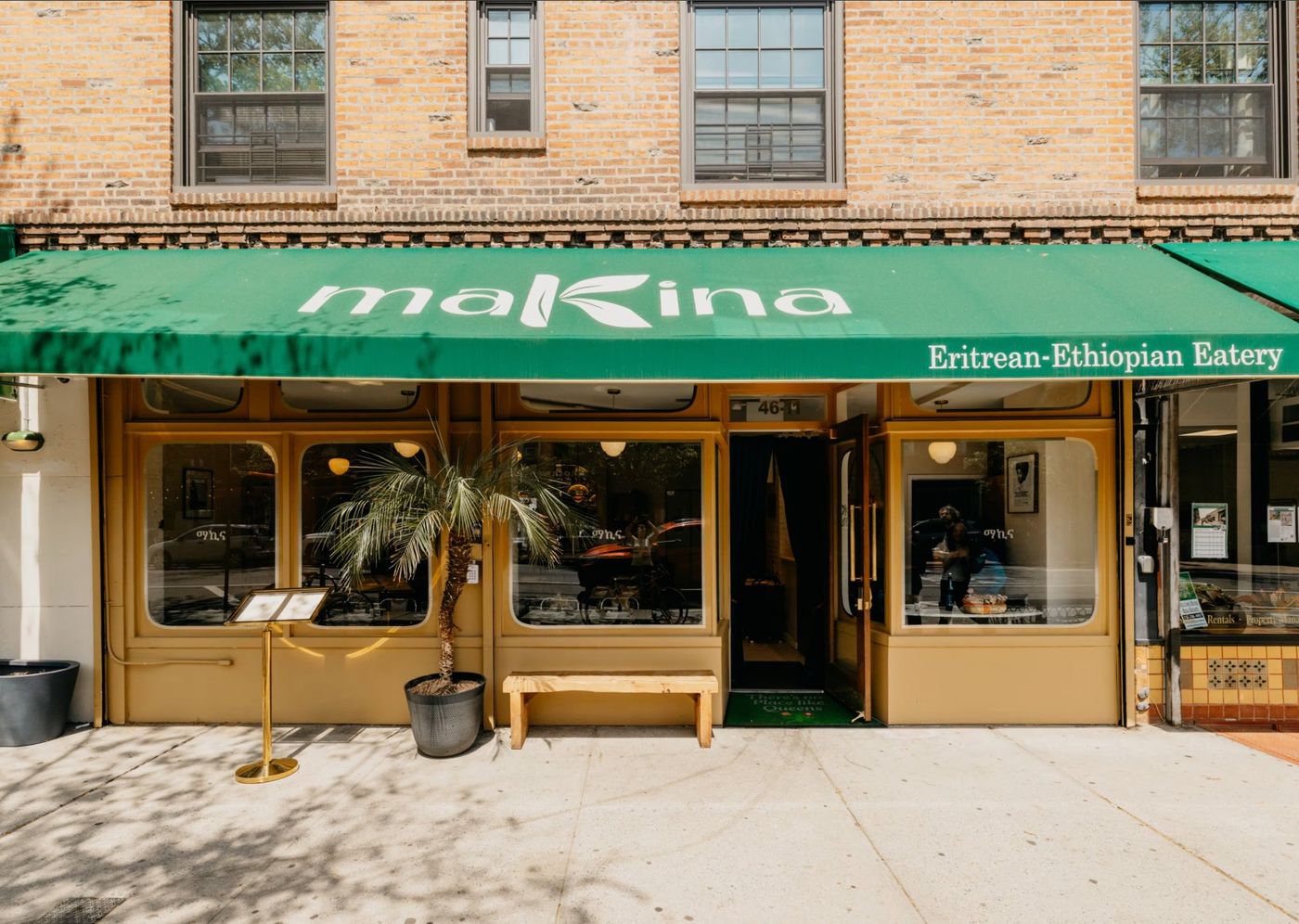 Makina storefront on the corner in Sunnyside, Queens — green awning reading Eritrean-Ethiopian Eatery